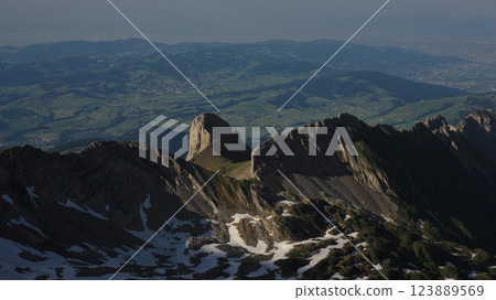 Ohrli, mountain of the Alpstein Range and hills on a misty summer day, Switzerland. Ohrli, mountain of the Alpstein Range and hills on a misty summer day, Switzerland. 123889569