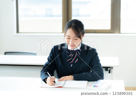 Students studying in classroom 123890101