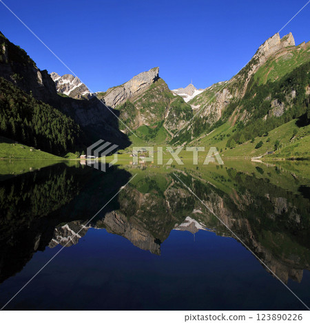 Alpstein Range mirroring in Lake Seealp, Appenzell. Alpstein Range mirroring in Lake Seealp, Appenzell. 123890226