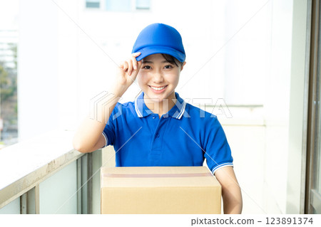 Courier female driver delivering luggage Courier female driver delivering luggage 123891374