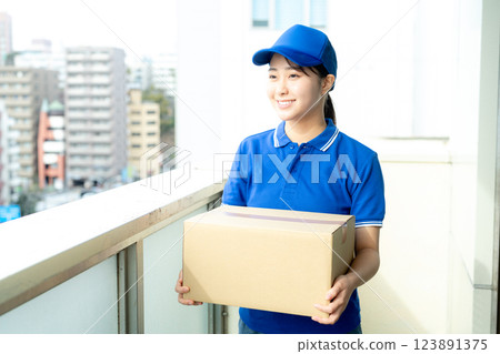 Courier female driver delivering luggage Courier female driver delivering luggage 123891375