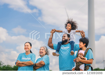 family of five is standing together, with one man holding a baby 123891698