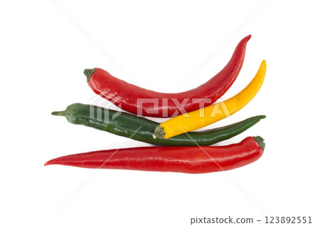Colorful chili peppers isolated on white background Colorful chili peppers isolated on white background 123892551