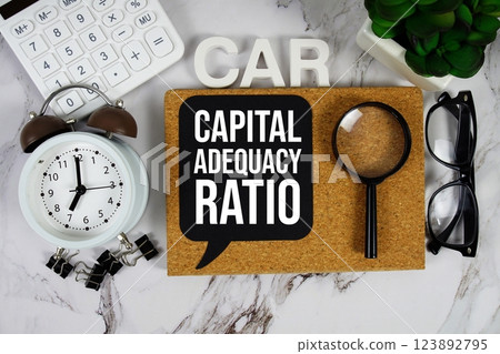 CAR - Capital Adequacy Ratio acronym with calculator, alarm clock and magnifying glass, business concept background CAR - Capital Adequacy Ratio acronym with calculator, alarm clock and magnifying glass, business concept background 123892795