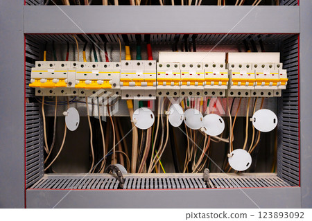 Network control panel with organized wiring and components in a utility room Network control panel with organized wiring and components in a utility room 123893092