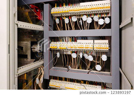 Electrical control panel with organized wiring and components in a commercial building Electrical control panel with organized wiring and components in a commercial building 123893197