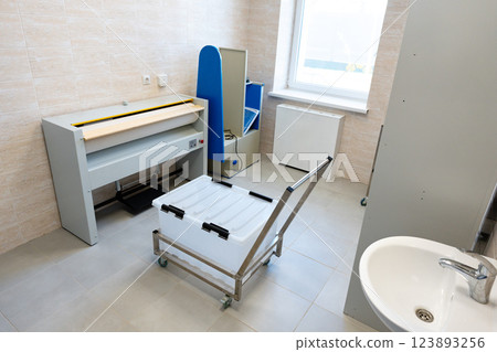 Medical examination room with functional equipment and clean design for patient assessments 123893256