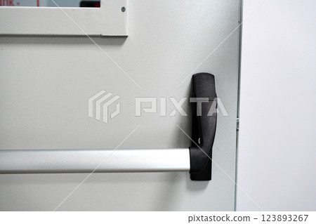Door handle design featuring a modern aesthetic and ergonomic grip for ease of use in commercial or residential spaces Door handle design featuring a modern aesthetic and ergonomic grip for ease of use in commercial or residential spaces 123893267