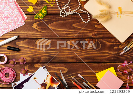 Crafting fun at a creative workspace with colorful materials on a wooden table 123893269