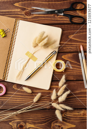 Creative workspace with stationery and natural elements for artistic projects and planning activities Creative workspace with stationery and natural elements for artistic projects and planning activities 123893677