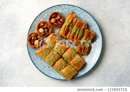 Delicious assortment of traditional Middle Eastern sweets served on a decorative plate Delicious assortment of traditional Middle Eastern sweets served on a decorative plate 123893728