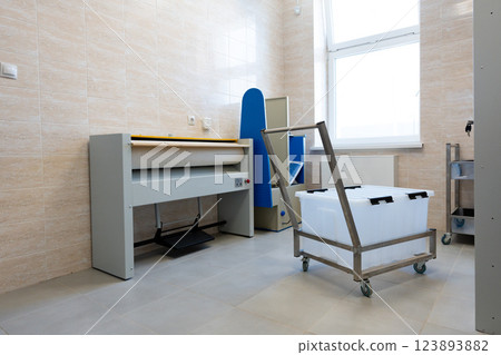 Work area featuring equipment for a clean and organized environment in a modern facility 123893882