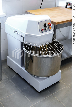 Industrial dough mixer in a modern kitchen ready for baking tasks 123894122