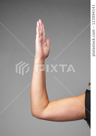 signaling a small size against a gray background signaling a small size against a gray background 123894141