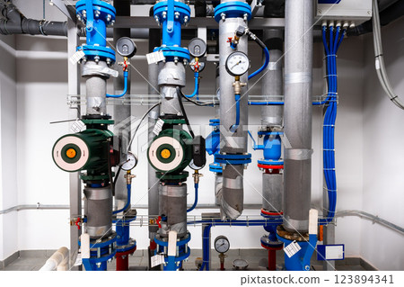 Industrial water pumping system showcasing blue and green components in a modern facility 123894341