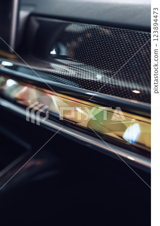 Close-up view of modern car interior features highlighting design elements and craftsmanship with intricate details Close-up view of modern car interior features highlighting design elements and craftsmanship with intricate details 123894473