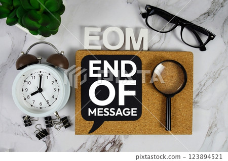 EOM - End of Message acronym with alarm clock and magnifying glass, business concept background EOM - End of Message acronym with alarm clock and magnifying glass, business concept background 123894521