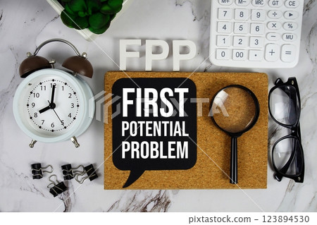 FPP - First Potential Problem acronym with calculator, alarm clock and magnifying glass, Business and Financial concept background 123894530