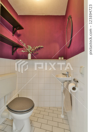 A contemporary restroom featuring bold purple walls, minimalist decor, and sleek fixtures that provide a chic atmosphere for users. A contemporary restroom featuring bold purple walls, minimalist decor, and sleek fixtures that provide a chic atmosphere for users. 123894723