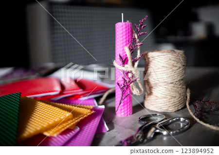 Colorful diy candle making with wax sheets and twine Colorful diy candle making with wax sheets and twine 123894952