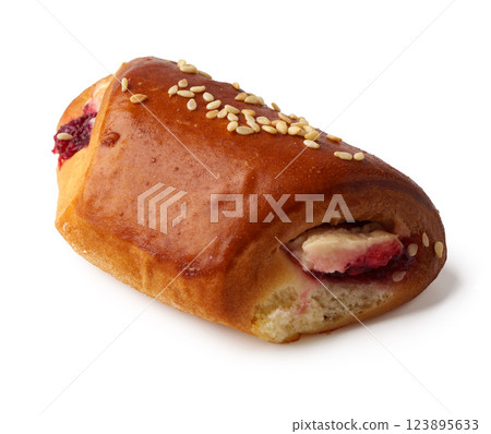 Delicious pastry filled with fruit and topped with sesame seeds 123895633