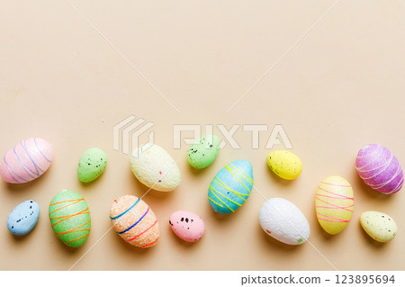 decorative easter eggs on colored background. easter eggs collection top view with copy space 123895694