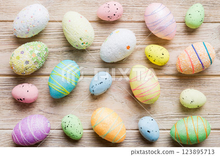 decorative easter eggs on colored background. easter eggs collection top view with copy space decorative easter eggs on colored background. easter eggs collection top view with copy space 123895713
