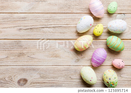 decorative easter eggs on colored background. easter eggs collection top view with copy space 123895714