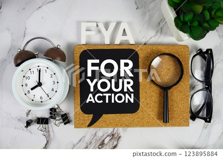 FYA - For Your Action acronym with alarm clock and magnifying glass, business concept background FYA - For Your Action acronym with alarm clock and magnifying glass, business concept background 123895884