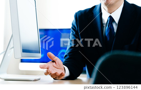 The hands of a man giving an explanation in an office The hands of a man giving an explanation in an office 123896144