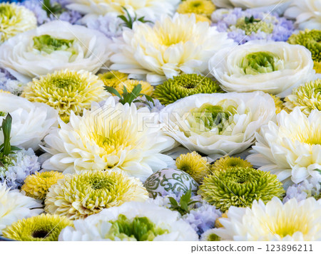 A beautiful flower water fountain decorated with January's seasonal flowers 123896211