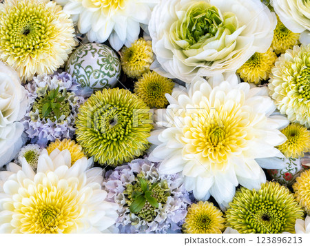 A beautiful flower water fountain decorated with January's seasonal flowers 123896213