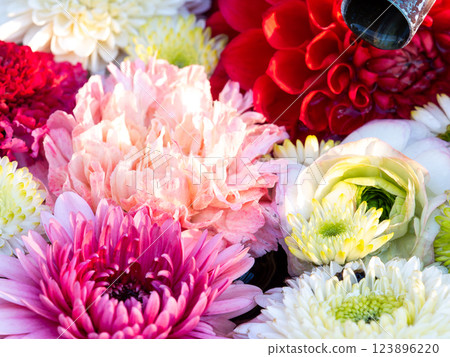 A beautiful flower water fountain decorated with January's seasonal flowers A beautiful flower water fountain decorated with January's seasonal flowers 123896220