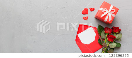 Valentine day composition with Envelope, rose flower and Red heart on table. Top view, flat lay. Holiday concept 123896255