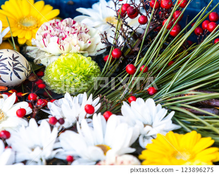 A beautiful flower water fountain decorated with January's seasonal flowers A beautiful flower water fountain decorated with January's seasonal flowers 123896275
