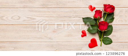 Valentine day composition with rose flower and red heart on table. Top view, flat lay, copy space Holiday concept Valentine day composition with rose flower and red heart on table. Top view, flat lay, copy space Holiday concept 123896276