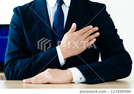 Businessman hitting his chest 123896400