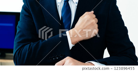 Businessman hitting his chest 123896455