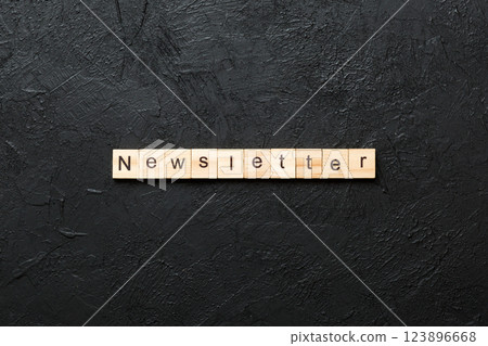 newsletter word written on wood block. newsletter text on table, concept 123896668