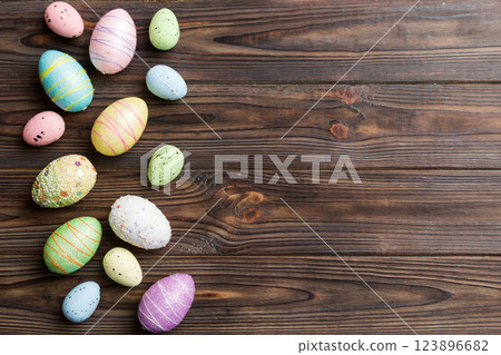 Happy Easter concept. Preparation for holiday. Easter eggs on colored background. flat lay top view copy space banner 123896682