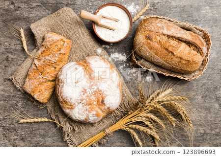 Homemade natural breads. Different kinds of fresh bread as background, top view with copy space 123896693
