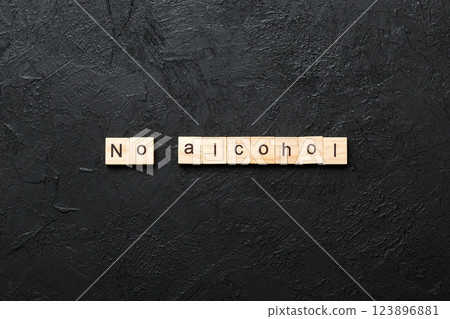 No alcohol word written on wood block. No alcohol text on cement table for your desing, Top view concept No alcohol word written on wood block. No alcohol text on cement table for your desing, Top view concept 123896881