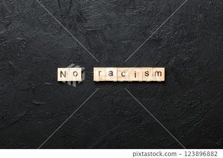 No racism word written on wood block. No racism text on table, concept 123896882