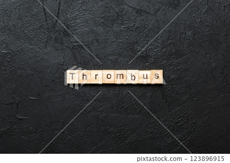 thrombus word written on wood block. thrombus text on table, concept thrombus word written on wood block. thrombus text on table, concept 123896915