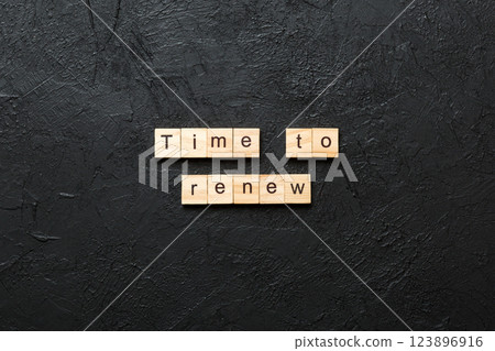 time to renew word written on wood block. time to renew text on table, concept time to renew word written on wood block. time to renew text on table, concept 123896916