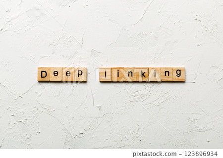 Deep Linking word written on wood block. Deep Linking text on cement table for your desing, concept 123896934