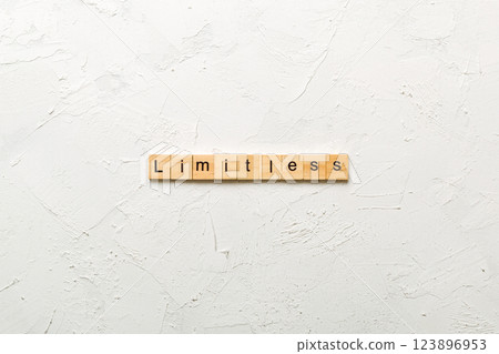 Limitless word written on wood block. Limitless text on cement table for your desing, concept 123896953