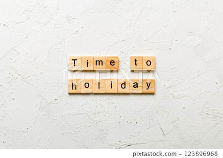 Time to holiday word written on wood block. Time to holiday text on cement table for your desing, concept 123896968