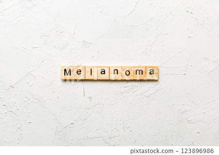 melanoma word written on wood block. melanoma text on table, concept melanoma word written on wood block. melanoma text on table, concept 123896986