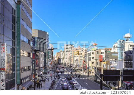 Urban Streetscape with Buildings and Traffic in Daylight Dec 9 2024 Urban Streetscape with Buildings and Traffic in Daylight Dec 9 2024 123897094